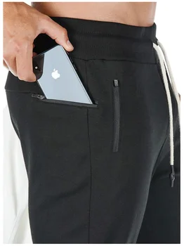 Mænds mode fitness bodybuilding bomuld sweatpants med håndklædeholder og mobiltelefon lomme løbe bukser casual jogger tights